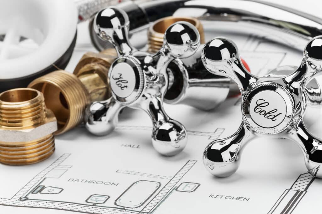 Plumbing Materials lying on drawing for repair.