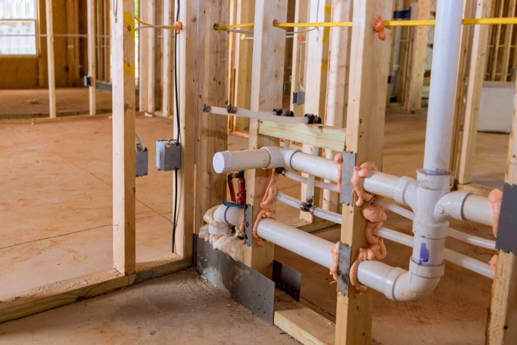 Residential Plumbing Upgrades with hot and cold blue and red pex pipe layout in pipes.