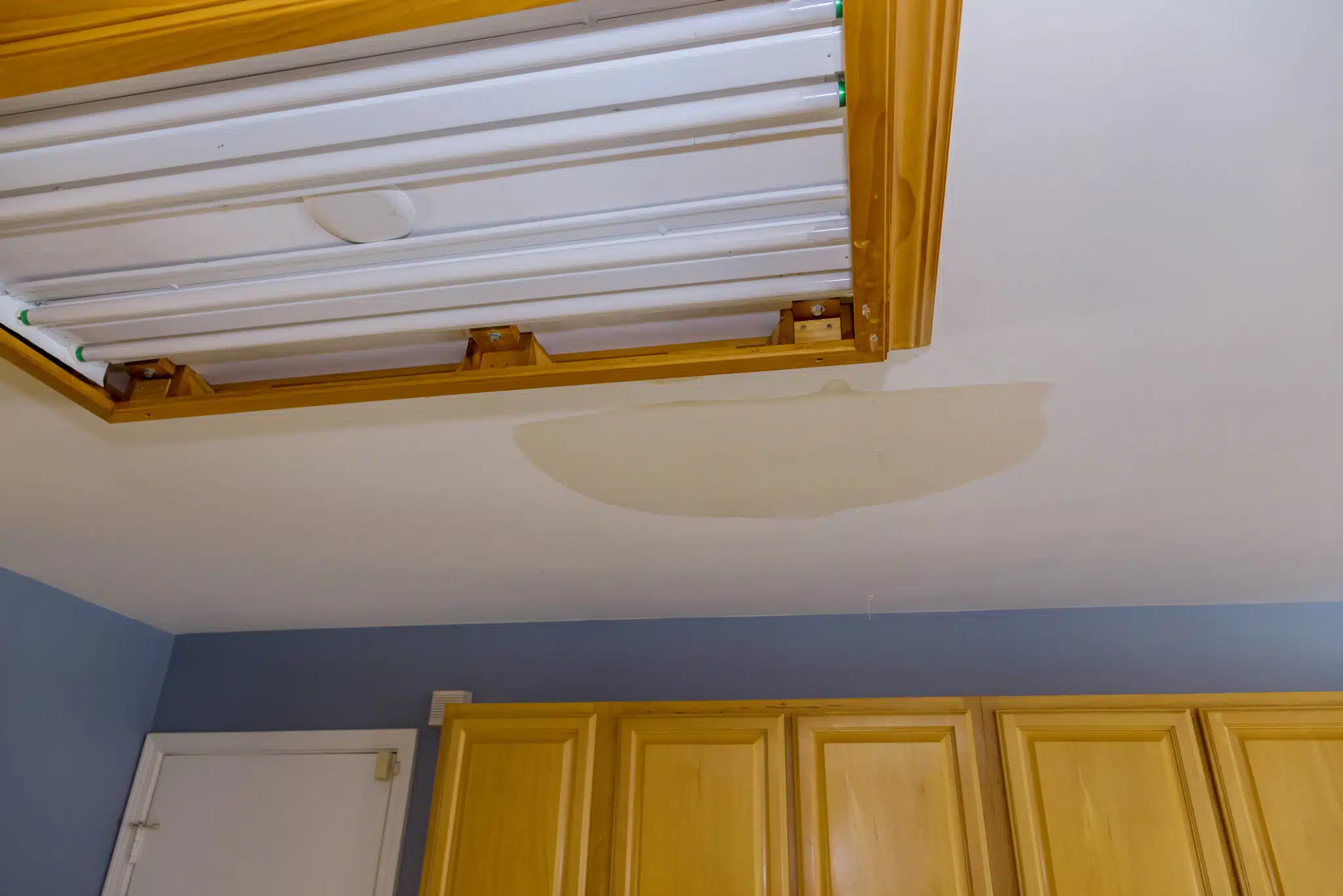 Ceiling kitchen in damage caused by a leaking water pipe, Plumbing Infrastructure Maintenance.